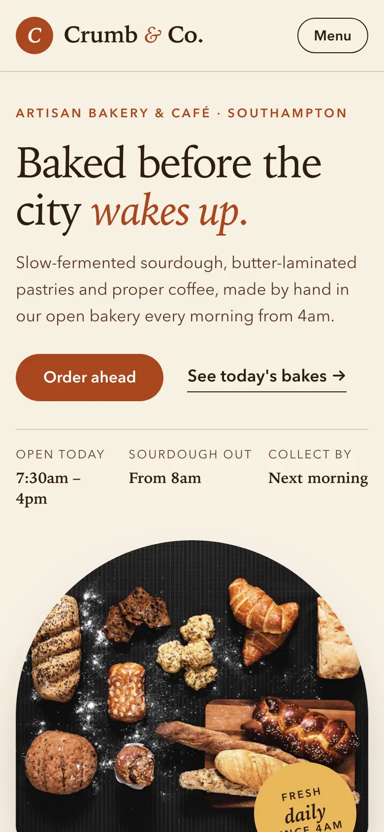 The Crumb & Co. bakery concept website on a phone, showing the headline, an order-ahead button and opening times